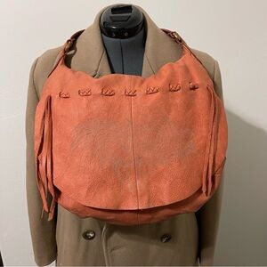 Lucky Brand peach slouchy, hobo bag, with feather emblem on front